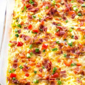 Confetti Bacon Hash Brown Breakfast Casserole - a great breakfast for entertaining filled with cheesy hash browns, eggs, chilies, green onions, and red bell pepper. the-girl-who-ate-everything.com