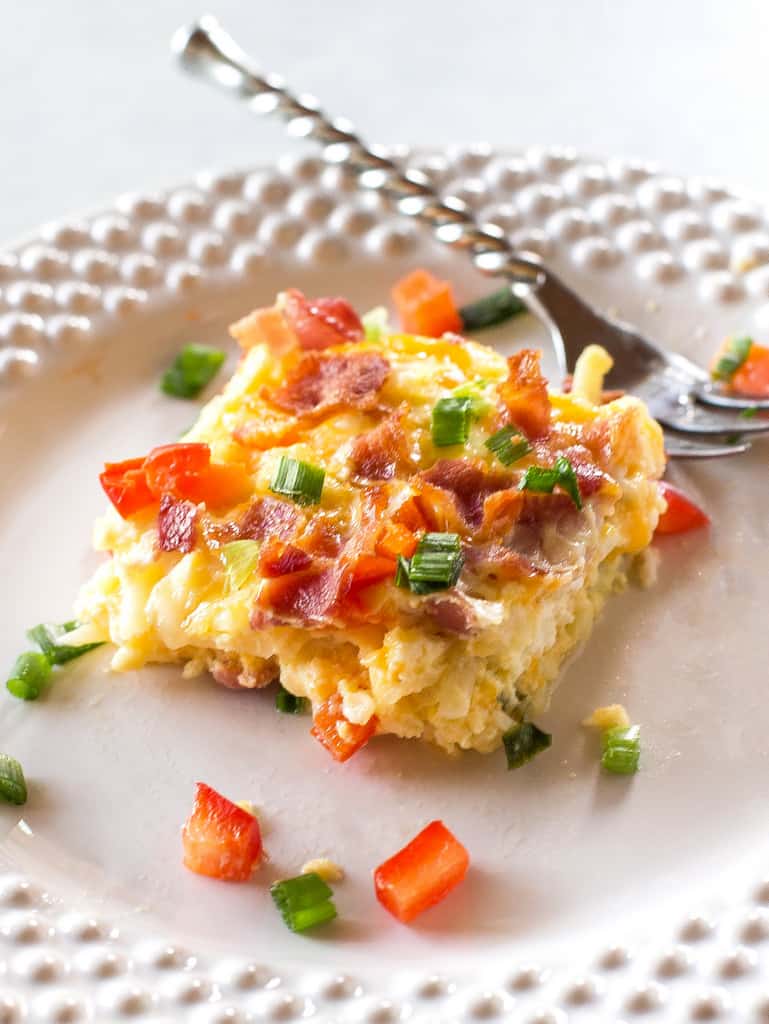 Confetti Bacon Hashbrown Casserole - a great breakfast for entertaining filled with cheesy hash browns, eggs, chiles, green onions, and red bell pepper. the-girl-who-ate-everything.com