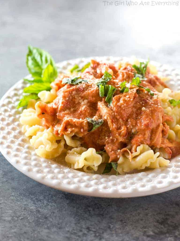 Creamy Tomato Basil Chicken - made in the slow cooker and served over pasta for an easy weeknight dinner. the-girl-who-ate-everything.com