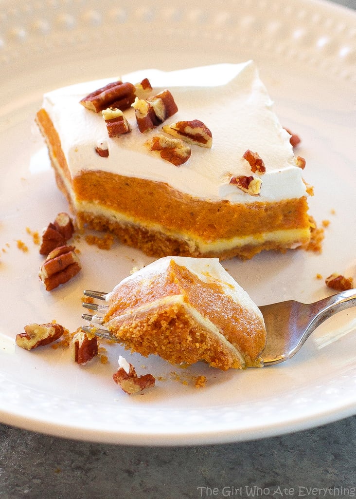 Pumpkin Pie Cheesecake Bars - A thick layer of graham cracker crust, creamy cheesecake, and spicy pumpkin pie flavored filling. the-girl-who-ate-everything.com