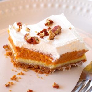Pumpkin Pie Cheesecake Bars - A thick layer of graham cracker crust, creamy cheesecake, and spice pumpkin pie flavored filling. the-girl-who-ate-everything.com