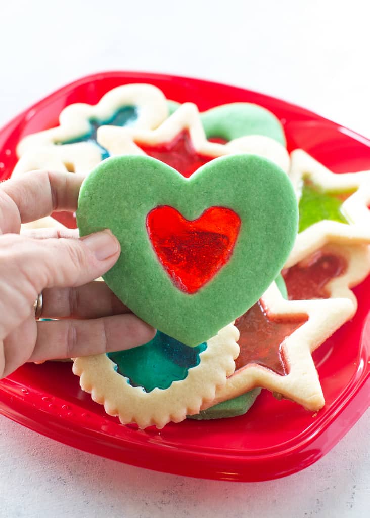 These Grinch Heart Cookies are magical little treats that you can make at Christmas with your kids. the-girl-who-ate-everything.com