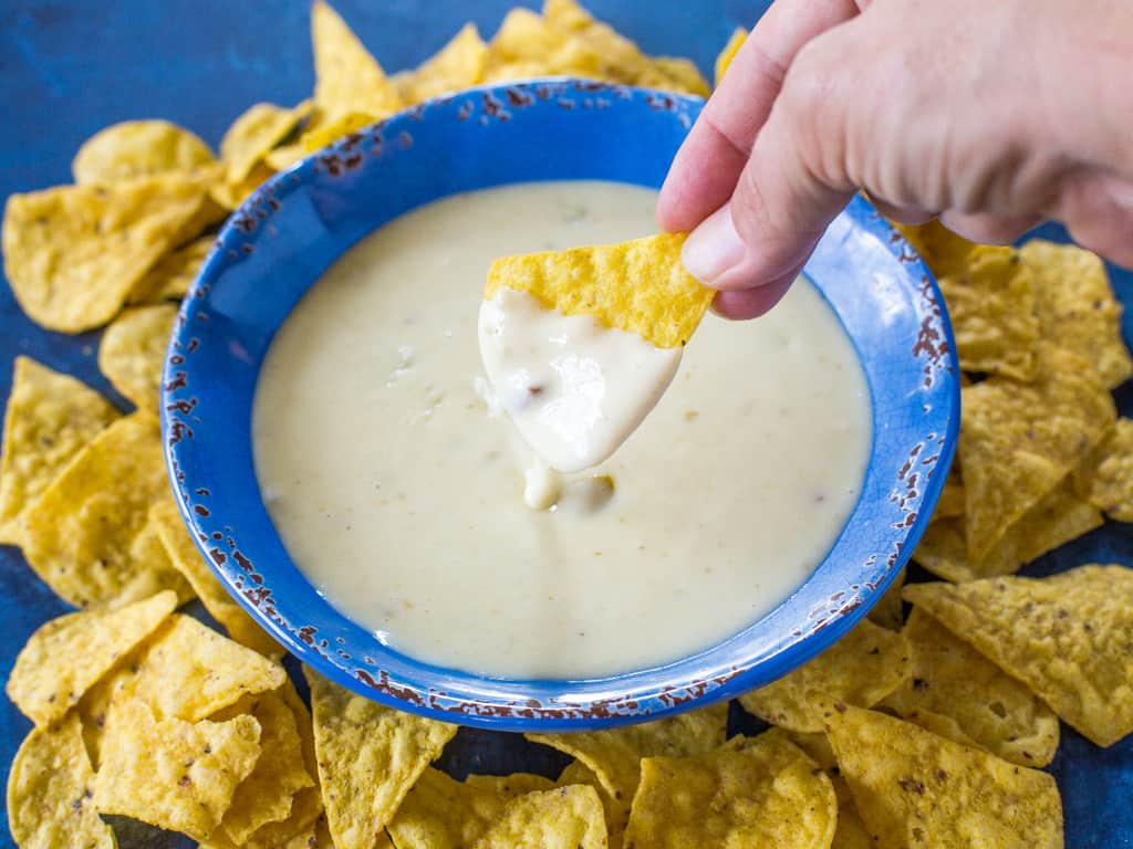 Queso Blanco Dip - only 4 ingredients to creamy, restaurant quality dip appetizer. Can be made in the crockpot too! the-girl-who-ate-everything.com