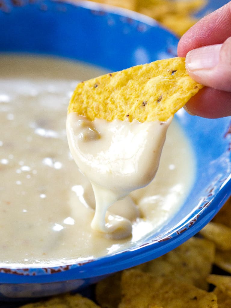 Queso Blanco Dip - only 4 ingredients to creamy, restaurant quality dip appetizer. Can be made in the crockpot too! the-girl-who-ate-everything.com
