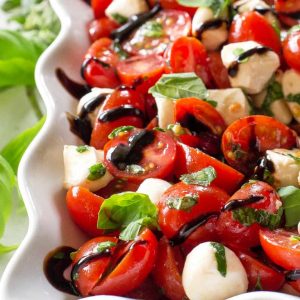 This Marinated Caprese Salad is a great side dish. Marinated in balsamic dressing and herbs, it has so much flavor.