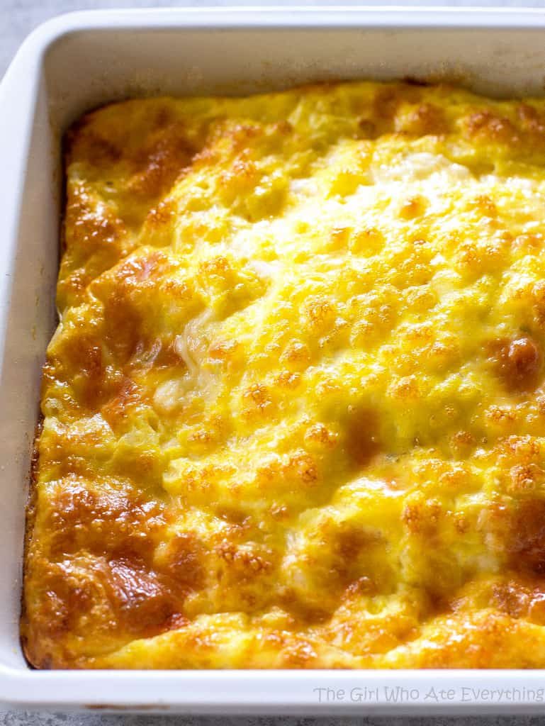 Cheesy Baked egg recipe in a white casserole dish