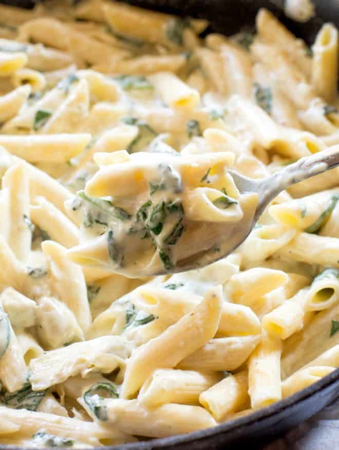 One-Pan Spinach Artichoke Pasta on a spoon