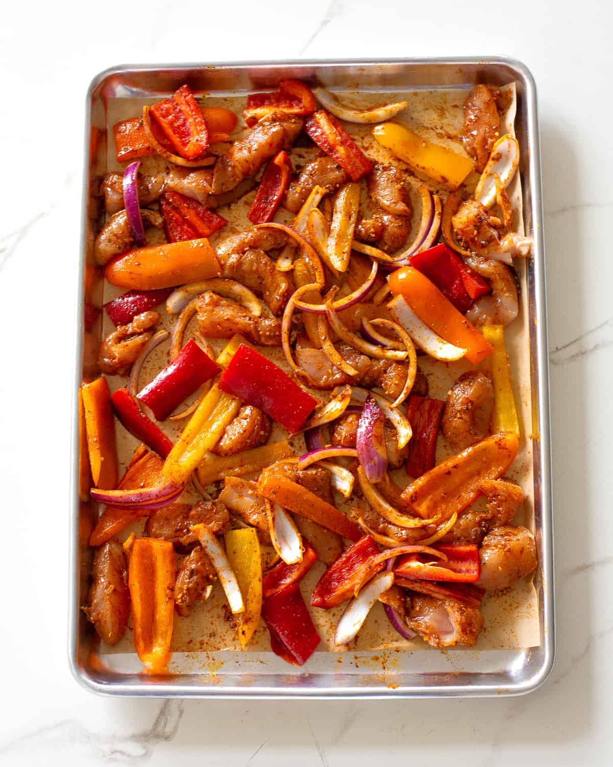 chicken and peppers with seasoning