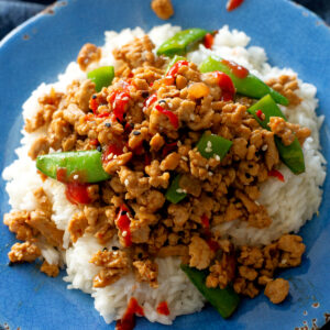 ground sesame chicken and snap peas over rice