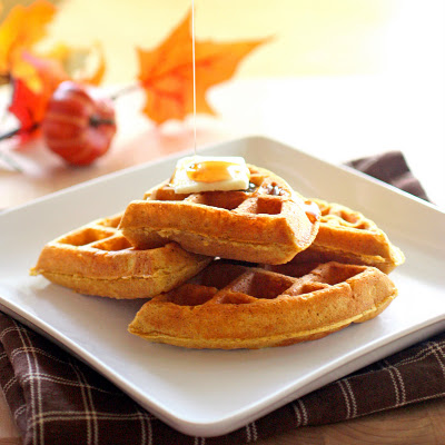 These pumpkin waffles are packed with spices and taste like fall for breakfast! the-girl-who-ate-everything.com