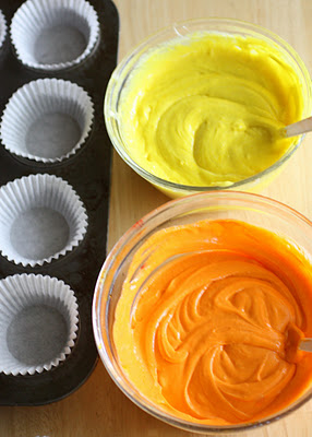 Candy Corn Cupcakes - a doctored cake mix makes these super moist candy corn colored cupcakes. Great for Halloween. the-girl-who-ate-everything.com