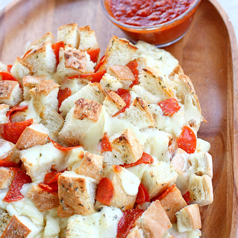 This Bloomin' Pizza Bread is filled with mozzarella and pepperoni. A great appetizer for a potluck!