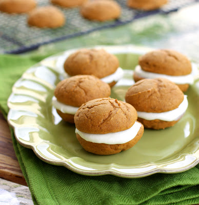 These Pumpkin Whoopie pies have a cream cheese filling inside. These Pumpkin Whoopie Pies have the perfect amount of spice and are made easy from a cake mix.