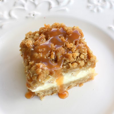 Caramel Apple Cheesecake Bars - These bars start with a shortbread crust, a thick cheesecake layer, and are topped with diced cinnamon apples and a sweet streusel topping. the-girl-who-ate-everything.com